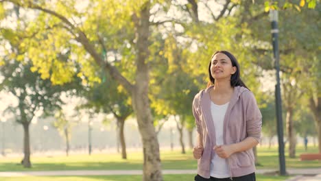 indian woman running in a park in morning time