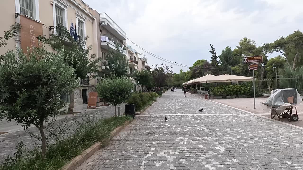 Walking through a very quiet Greek street.