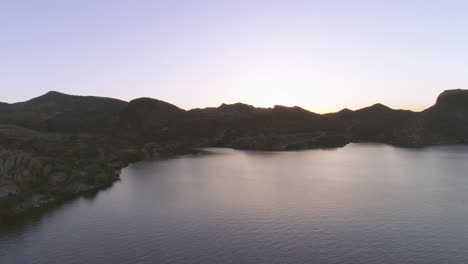 AERIAL---Desert-Lake-Surrounded-by-Mountains