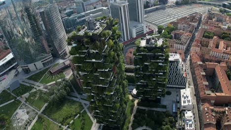 cinematic drone shots unveil a bustling cityscape, featuring buildings adorned with vibrant greenery and streets winding between plant-covered facades and contemporary urban structures.
