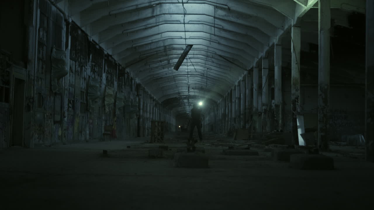 Abandoned Factory at Night with Security Personnel