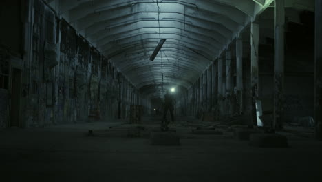 abandoned factory at night with security personnel