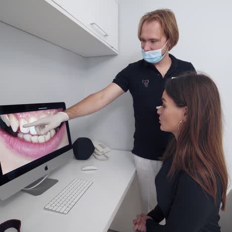 dentist checking teeth of patient