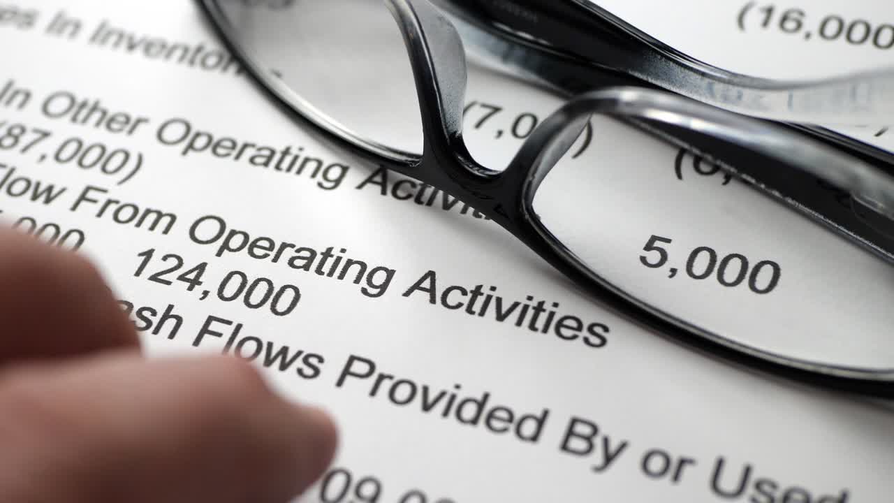 Finger tapping on financial report