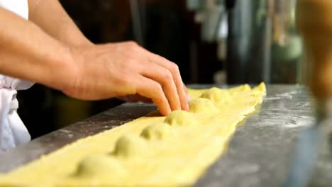 male baker preparing pasta in bakery shop 4k