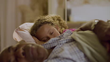 grandpa and his little girl falling asleep on couch