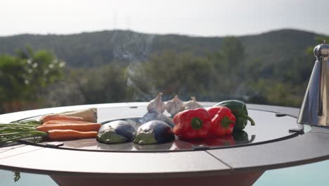 carrots, avocados, and peppers being roasted on a bbq for a party