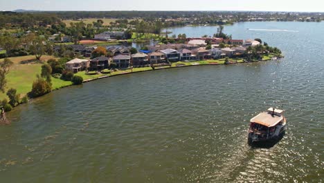 the paddle steamer cumberoona approaching the houses on cypress drive mulwala, nsw, australia