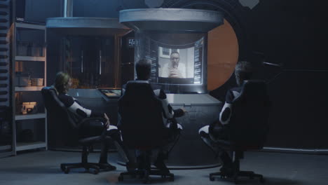 astronauts in a space control room
