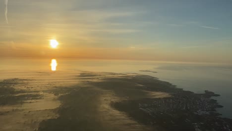 Aerial-side-view-of-a-dawn-over-Menorca-Island,-Spain-Mediterranean-Sea