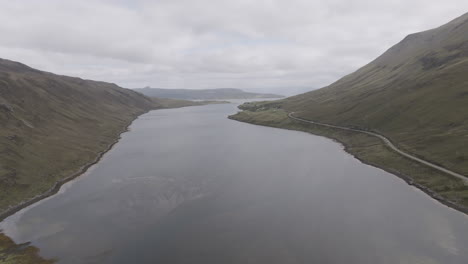 loch sligachan aerial pull back shot revealing river and marsh