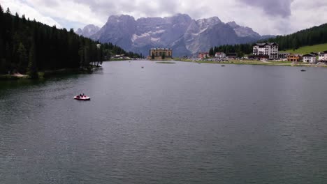 aerial view of tourist boat on lake misurina in dolomites mountain