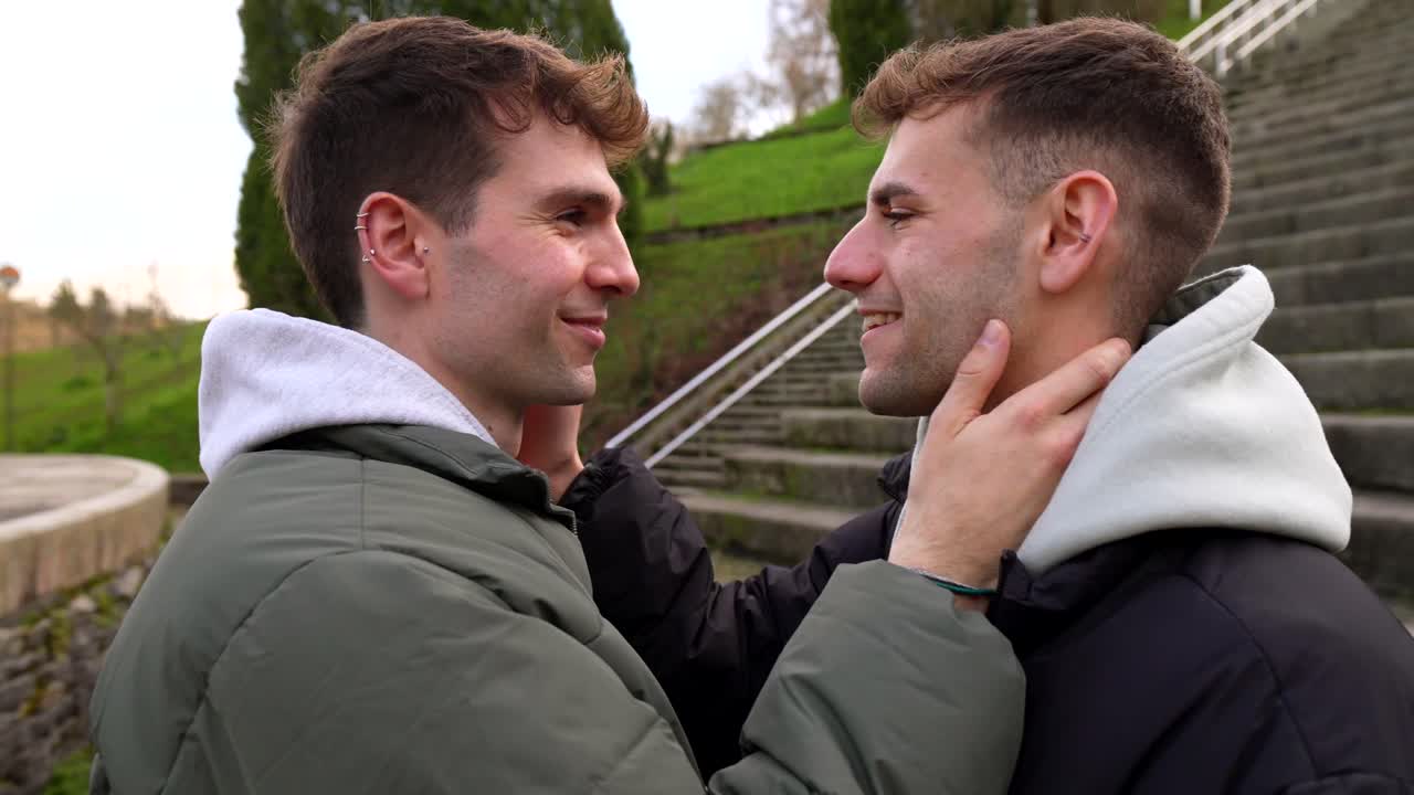 Two Men Embracing with Pride Flag