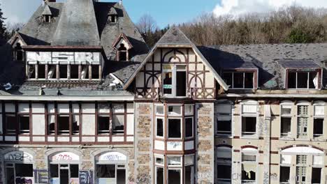 Moving-away-from-a-broken-window-of-an-abandoned-hospital