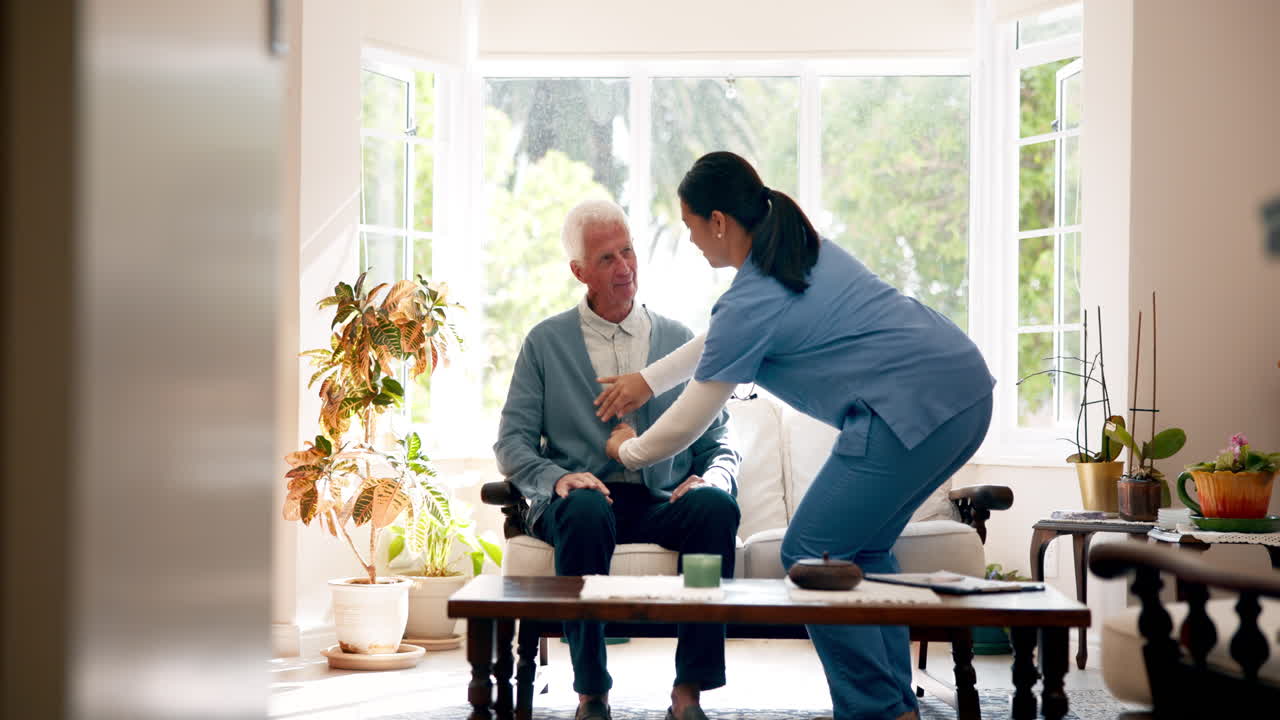 Nurse examining elderly patient in home setting