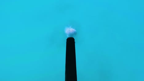 environment pollution by industrial chimney smoke. blue background