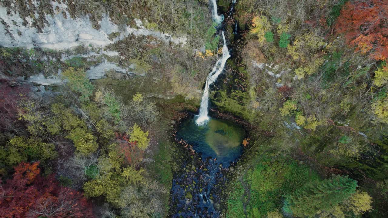 aerial shot of the gorges du flumen waterfall in Jura departement, Bourgogne Franche Comte region, french countryside on a clear day of autum