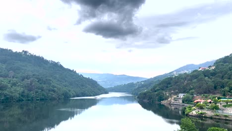 douro river reflecting the beautiful and calm green waters under the sky