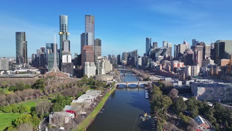 arts centre melbourne and river bridges in wide aerial view over the yarra river