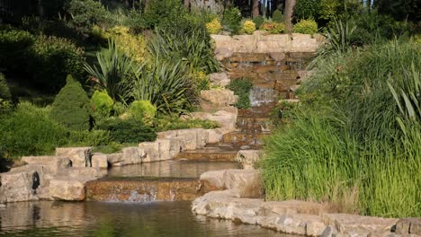 a stone waterfall in a garden