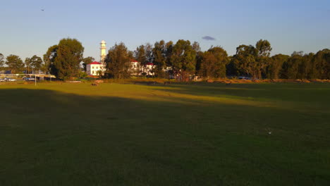 Drone-shot-towards-Sikh-gurdwara-with-a-mob-of-Kangaroos-Australia-NSW