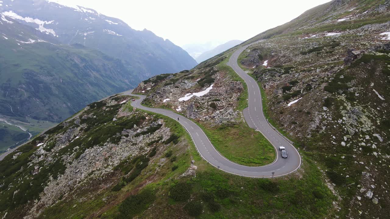 Alpine pass road winds over dramatic cliffs in Austria’s Großglockner panoramic