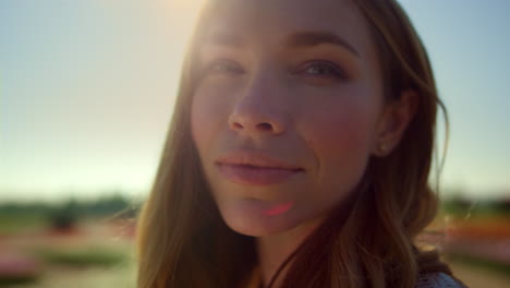 portrait of calm woman in sky background. closeup woman face smiling outdoors.