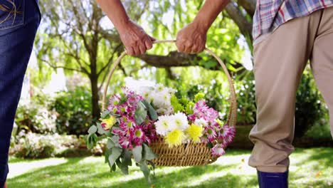 Senior-couple-walking-in-garden-