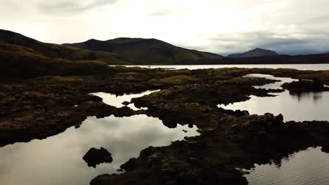 Aerial-landscape-view-of-natural-textures-and-patterns-of-the-Icelandic-highlands-terrain-and-water-ponds