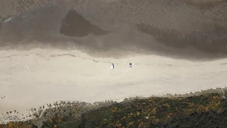 cars parked on pacific city beach, oregon, usa