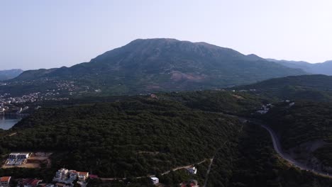 Forest-mountain-revealing-calm-blue-water-of-Adriatic-sea-at-Montenegro