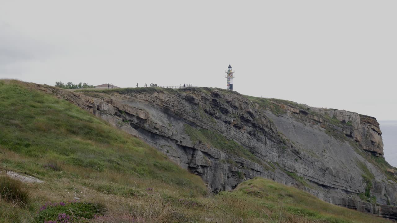 Scenic view of Faro de Ajo lighthouse in Cantabria, Spain on a cloudy day