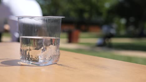 glass of water in a park