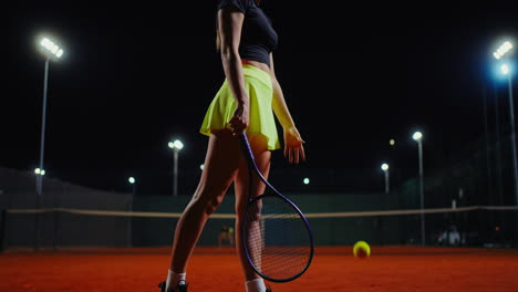 female tennis player at night