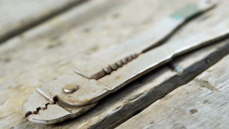 vintage work tool on wooden plank