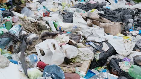 large landfill full with toxic waste flying above large landfill full with toxic waste near a city industrial garbage pile trash dump