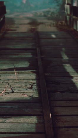 old wooden bridge over a small stream in a park