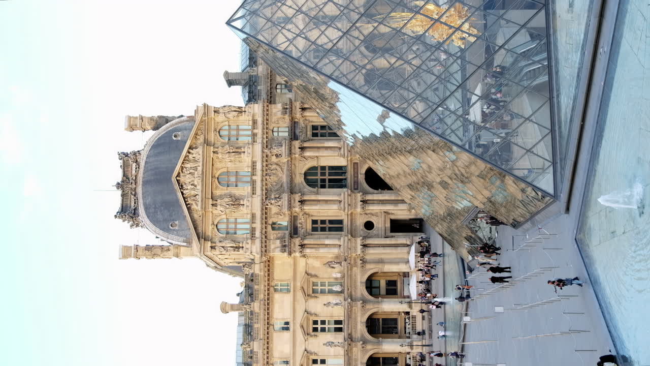 Paris, France - November 21, 2021: Front view of the Louvre Museum in daylight. Vertical