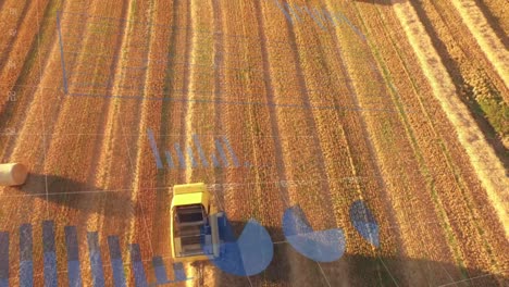 animación del procesamiento de datos estadísticos sobre una vista aérea de un tractor que opera en los campos agrícolas