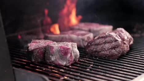 delicious steaks grilling on a bbq