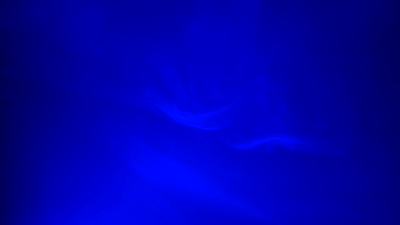 Ambient, abstract, ethereal blue smoke and light motion background for mystical, dreamlike, background atmosphere with calm, serene slow motion fog and moving smoke and light.