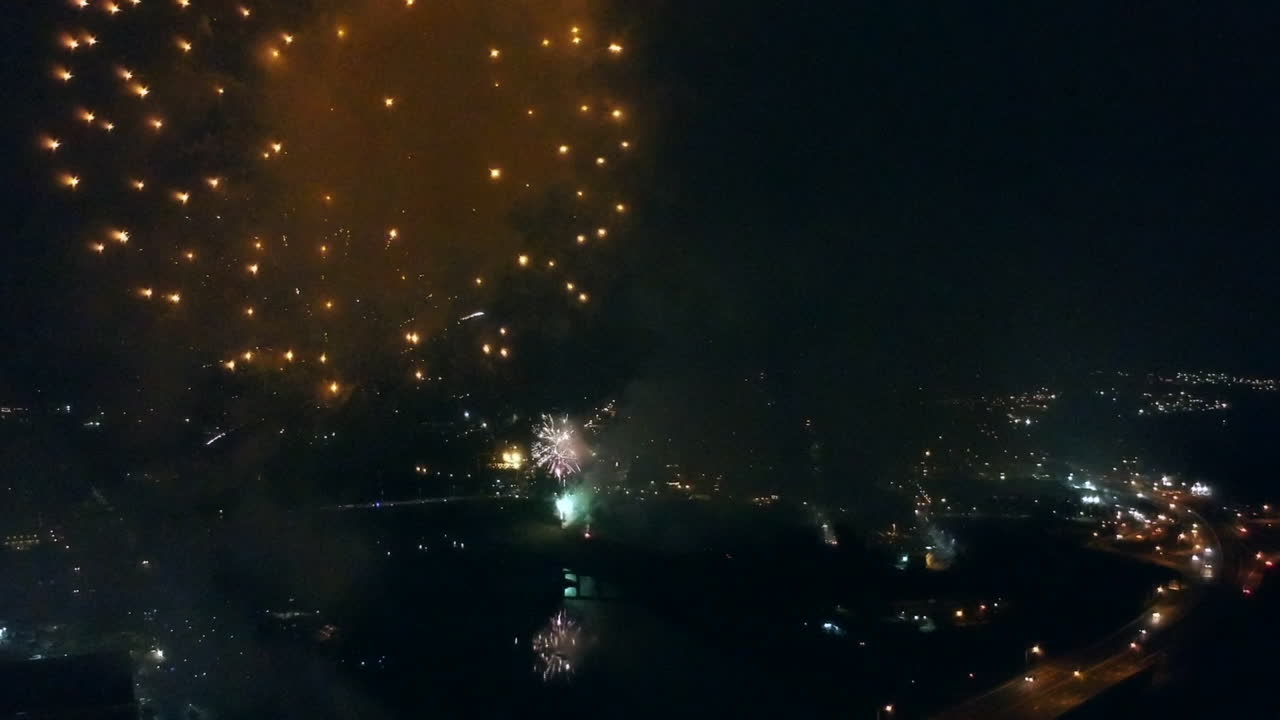 Drone footage of fireworks  high above a highway