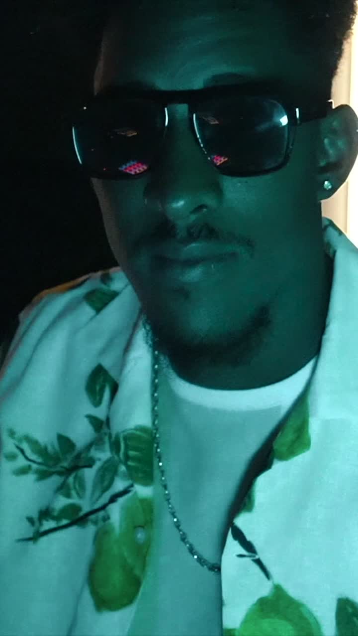 Man in Sunglasses and Hawaiian Shirt