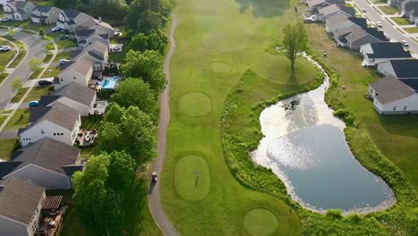 drone video of a golfer hitting their tee shot on the golf course