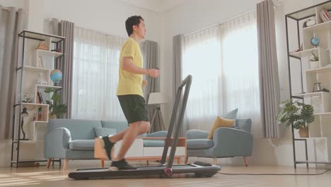 man running on a treadmill at home