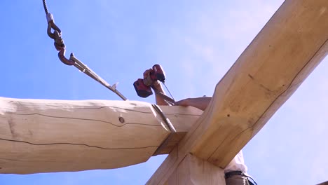 log home construction - beam installation