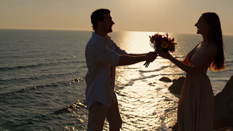 romantic couple's sunset moment by the ocean