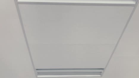 view of bright ceiling with energy-saving lighting, modern office with white ceiling and nice design