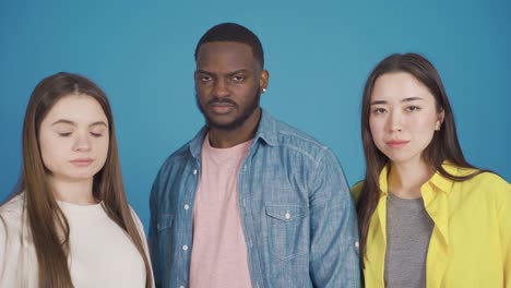 close-up portrait of three multiethnic people. different race and ethnicity concept.