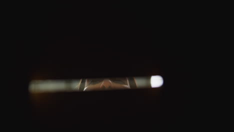 point of view shot of female worker in distribution warehouse closing and sealing box